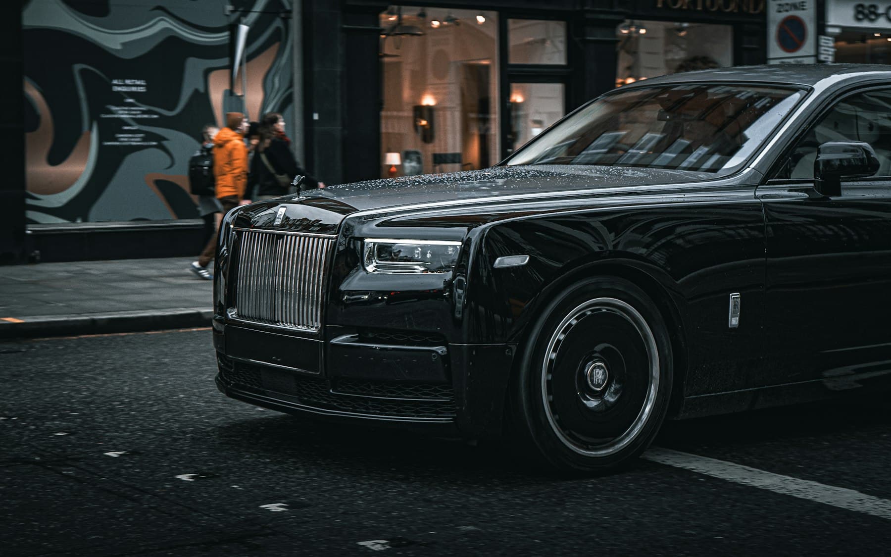 Black Rolls-Royce Phantom waiting kerbside on a London street